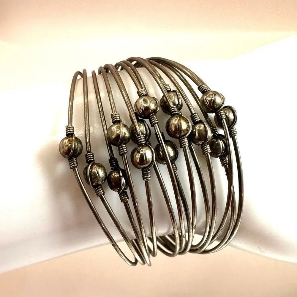 Silver tone multi strand cuff bracelet
